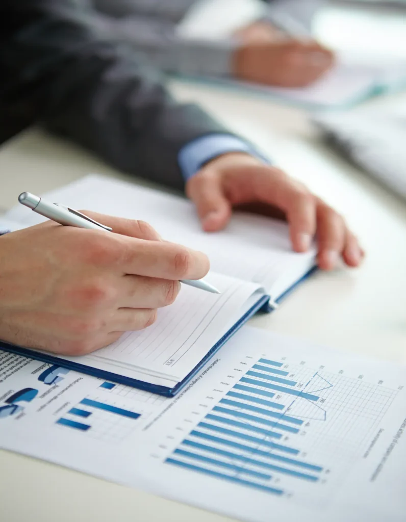 close-up-businessman-writing-summary