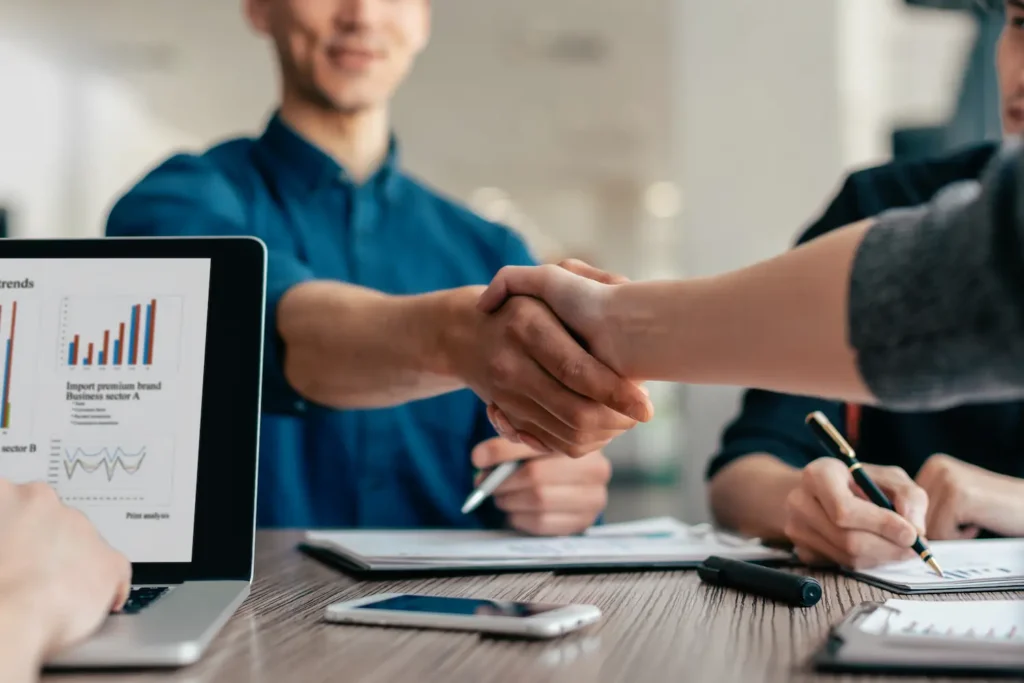 young-people-greeting-each-other-work-table